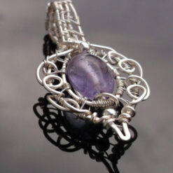 Wire wrapped purple Quartz pendant.