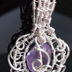 Wire wrapped purple Quartz pendant.