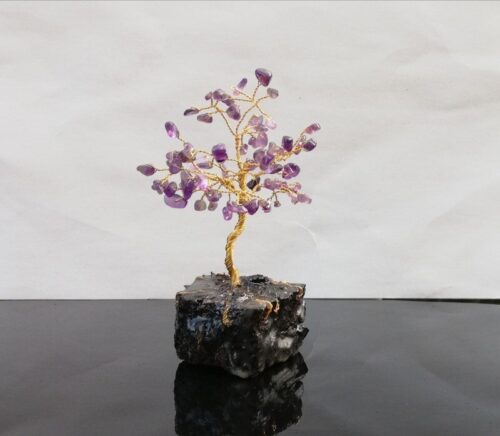 Amethyst tree of life wire sculpture on turf