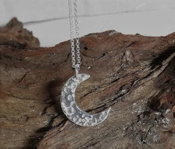 Fine Silver crescent moon pendant necklace on sterling silver chain.