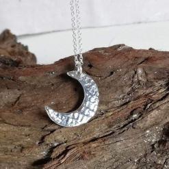 999 fine silver crescent new moon pendant necklace on sterling silver chain.
