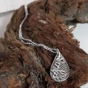 fine silver, small oval teardrop pendant necklace on a sterling silver chain.