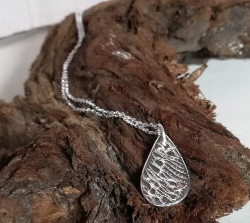 fine silver, small oval teardrop pendant necklace on a sterling silver chain.