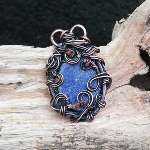 wire wrapped Lapis Lazuli pendant necklace with accents of red and orange agate stones