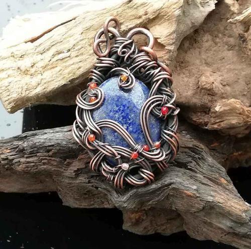 Wire wrapped blue lapis lazuli pendant with tiny orange and red Agate beads