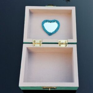 inside of blue dancing girl trinket box, dusty pink with heart shaped mirror