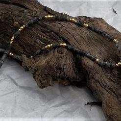 necklace with black grey gold beads, and focal agate slice
