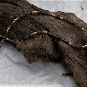 necklace with black grey gold beads, and focal agate slice