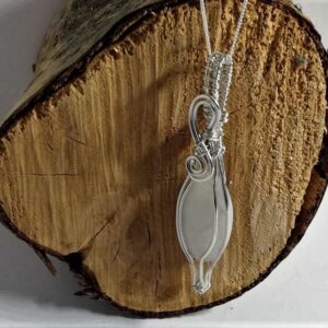 Long oval rainbow moonstone wrapped in Sterling Silver wire
