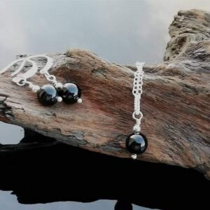 black tourmaline rounds on sterling silver, necklace chain and fancy earrings.