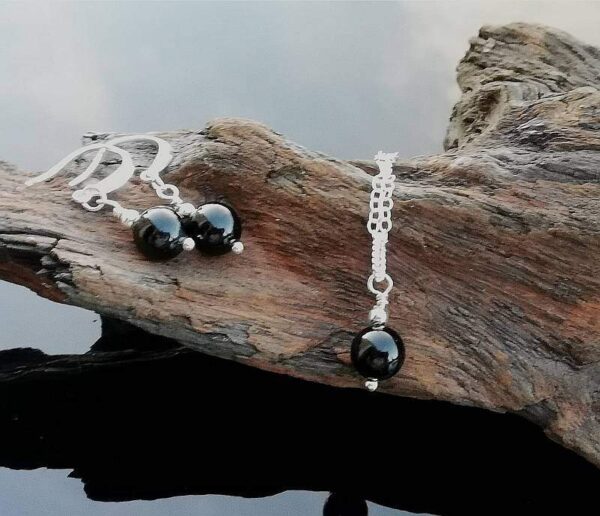 black tourmaline rounds on sterling silver, necklace chain and fancy earrings.