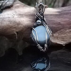 Angelite wire wrapped pendant with clear quartz stone.