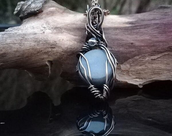 Angelite wire wrapped pendant with clear quartz stone.