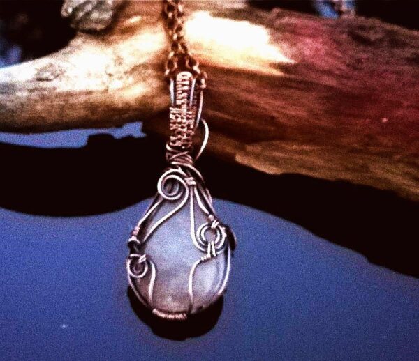 grey quartz stone in copper wire. pendant