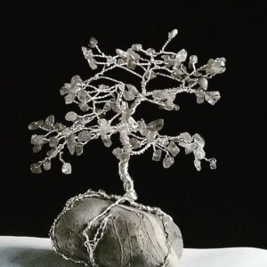 Small wire and Labradorite tree sculpture on a grey stone