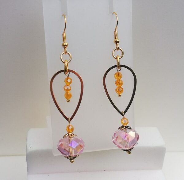 long earrings, gold frame, orange beads inside, large pink crystal bead drop. fancy earrings