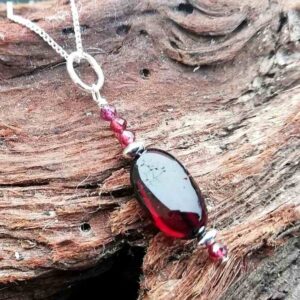 necklace with cherry amber with red stones and sterling silver