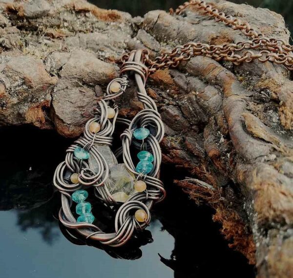 citrine, neon blue apatite and orange agate woven in copper wire. Pendant necklace