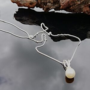 white pearl drop on sterling silver chain.