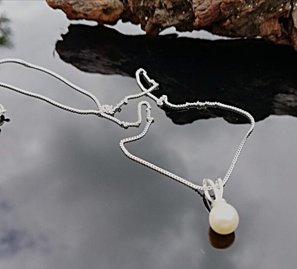 white pearl drop on sterling silver chain.